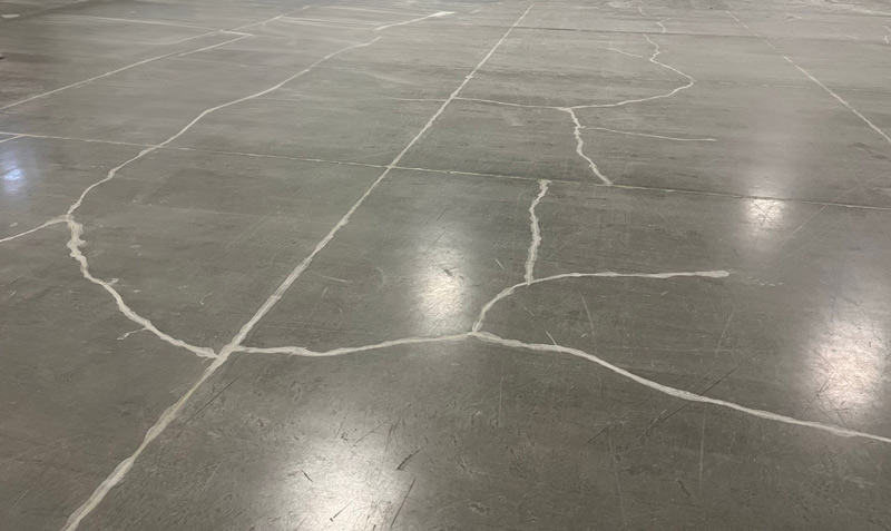 Sealant applied to a slab for fixing cracks in concrete, ensuring a moisture-proof and durable surface repair.