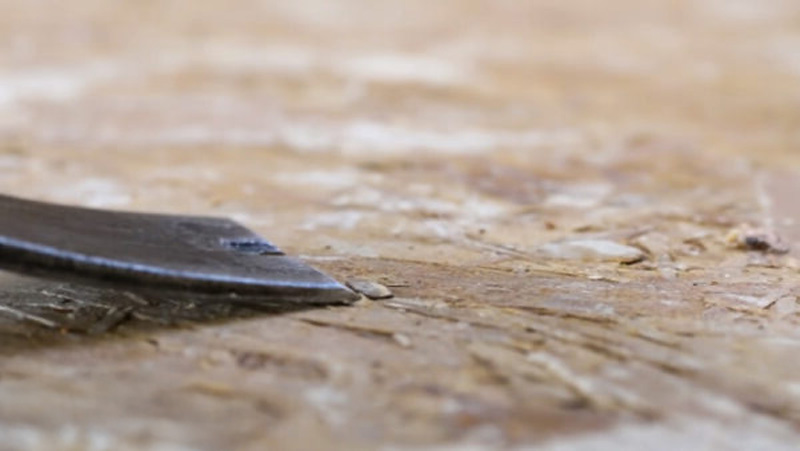 Professional floor preparation and scraping to improve flooring durability by removing weak concrete layers.
